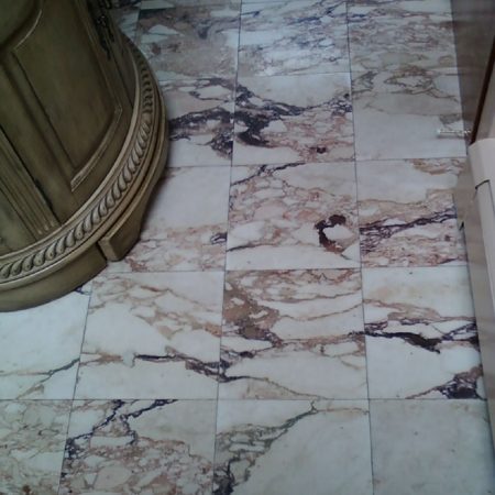 Tranished Small Bathroom. Unpolished Marble Floor