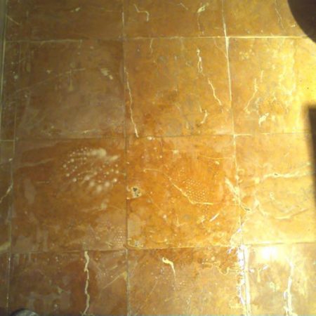 Tarnished Bathroom Floor During Restoration