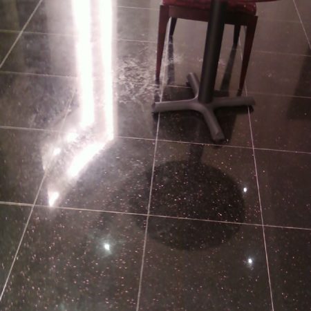 Wax Peeled Off on Black Galaxy Granite