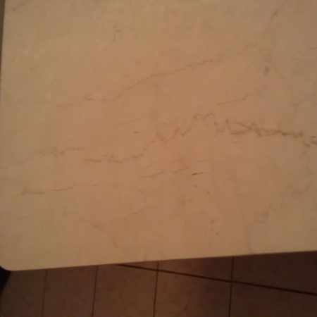 broken marble table after image Corner of Botticino Table. After Cracks Repair
