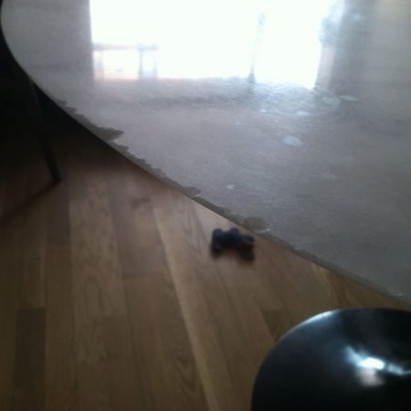 chipped table before image Nocks on Knife Edge on Round Marble Table