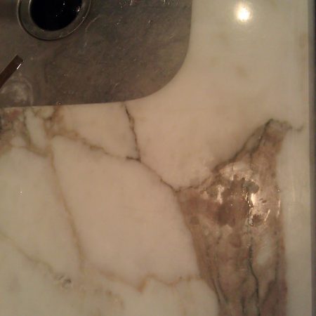 Etches and Blots on Lackluster Calacatta Gold Countertop