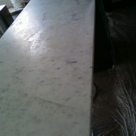 Splotchy Blots and Ring Marks on White Countertop Surface