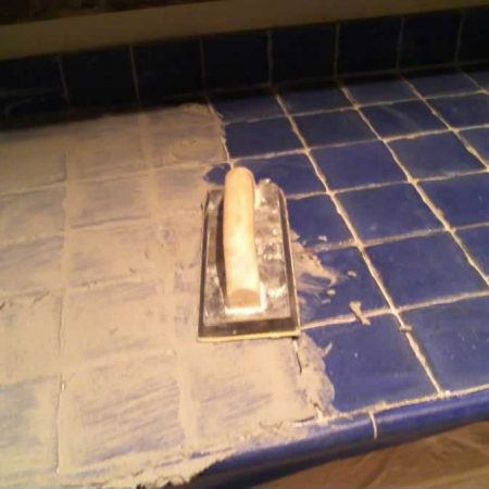 Blue Tiles on Counter During and After Re-Grouting