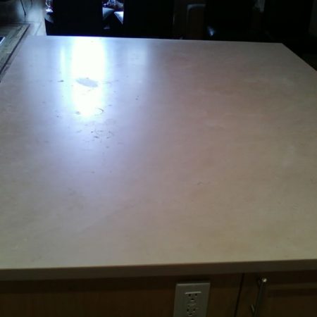 Splotchy Crema Marfil Countertop with Water Rings and Spots