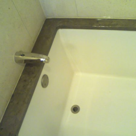 Limestone Bathtub Top. Discoloration & Erosion Removal