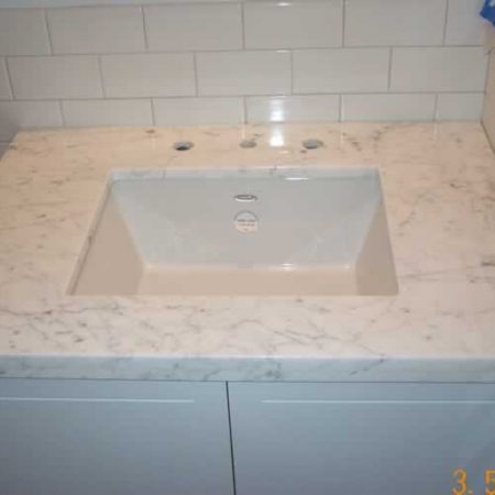 marble sinktop image White Carrara Vanity. Sink Installed