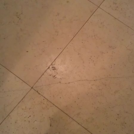 Limestone Cracked Tile under Door Frame