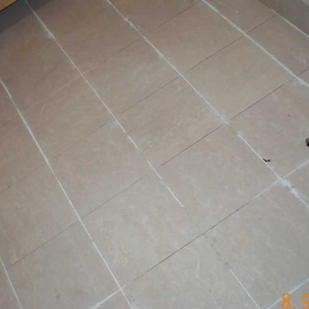 Removing Old Grout from Tiled Bathroom Floor