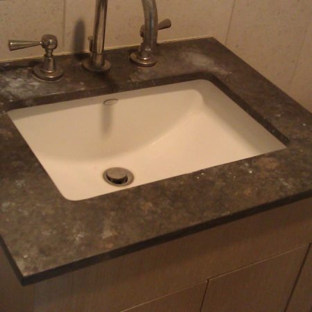 Splotchy Soap Stains on Brown Limestone SinkTop