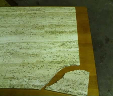 Broken off Corner on Travertine Coffee Table