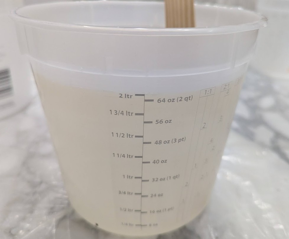 Transparent Polyester Resin Epoxy 2 Liters image Two-liter 64 oz transparent polyester resin epoxy used for professional marble table recoating