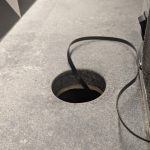 Engineered quartz countertop with 3-inch hole enlarged for airflow