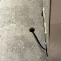 Engineered quartz countertop with existing hole before core drilling
