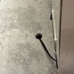 Engineered quartz countertop with existing hole before core drilling