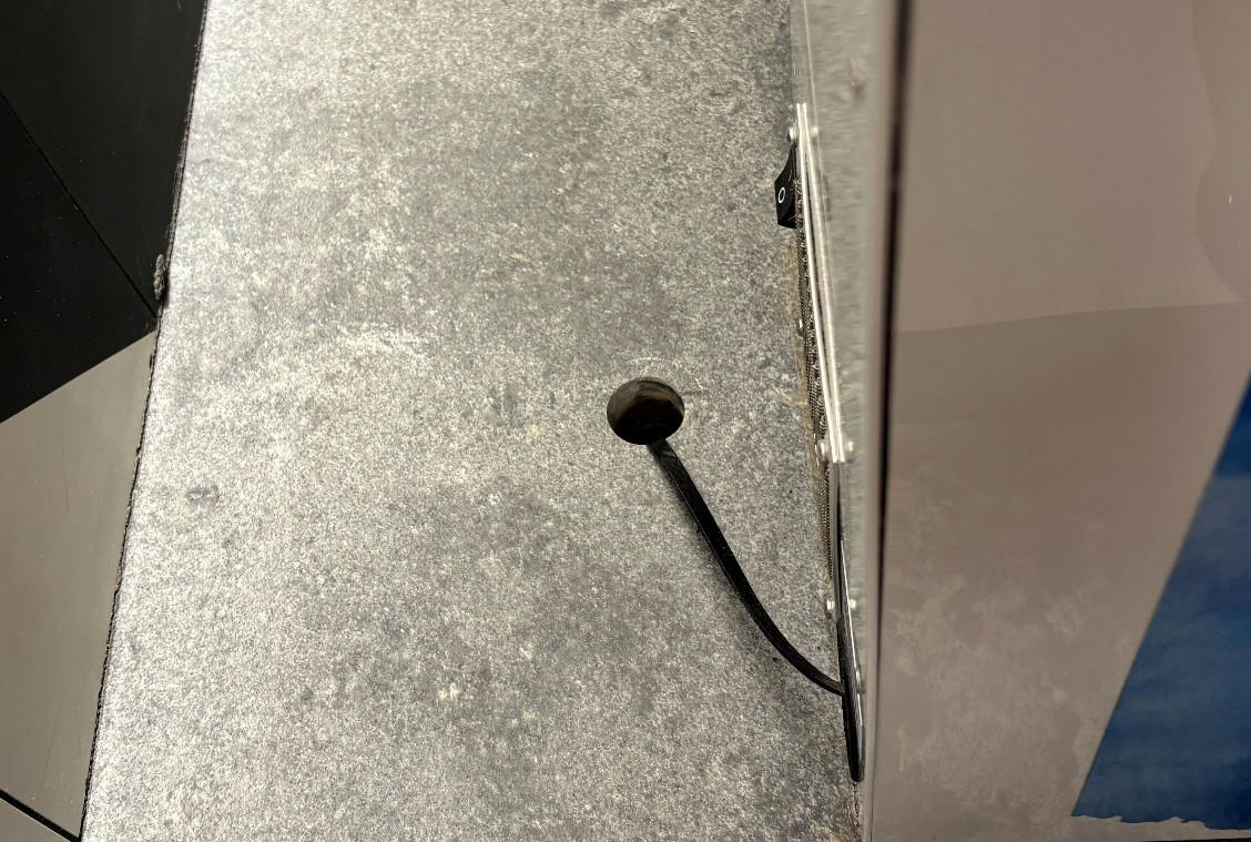 Before: Engineered Quartz Hole Enlargement, Manhattan NYC Engineered quartz countertop with existing hole before core drilling