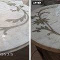 White Carrara marble coffee table top with gold painted flowers, dull and etched, next to the same top polished and reflecting the light