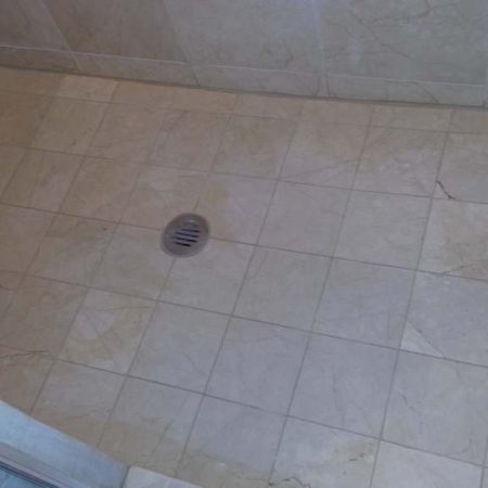 Deep Erosion on Shower Floor Ground Down