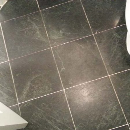 Fogging Discoloration on Black Serpentine in Bathroom