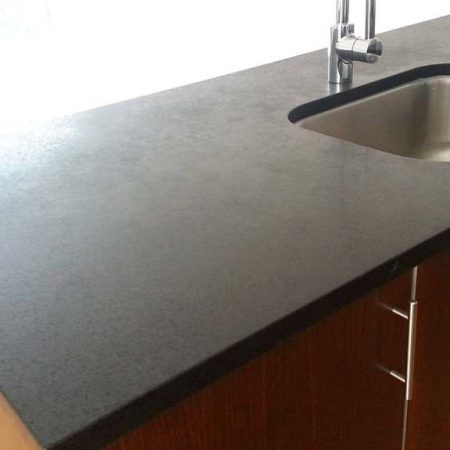 Splotchy Gray/Black Granite with Black Opaque Flake Marks on Kitchen Counter