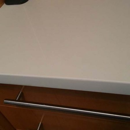 man made stone chip filed out image Chip Sanded Out from Man Made Counter Edge