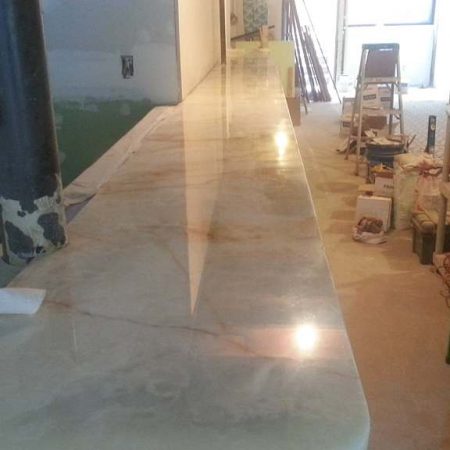 Splitted Onyx Bar Top in Restaurant. After Cracks Seaming