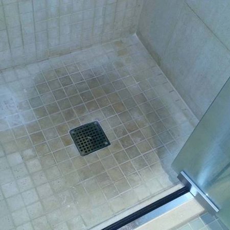 Stains and Grime on Limestone Shower Floor