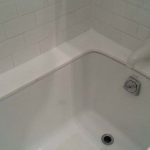 White Glass Bathtub Top After Recaulking