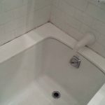 White Glass Bathtub Top Before Recaulking