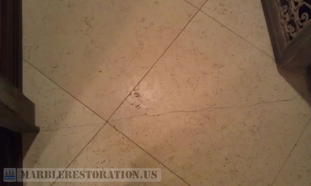 Limestone Floor Tile Crack. Before Restoration