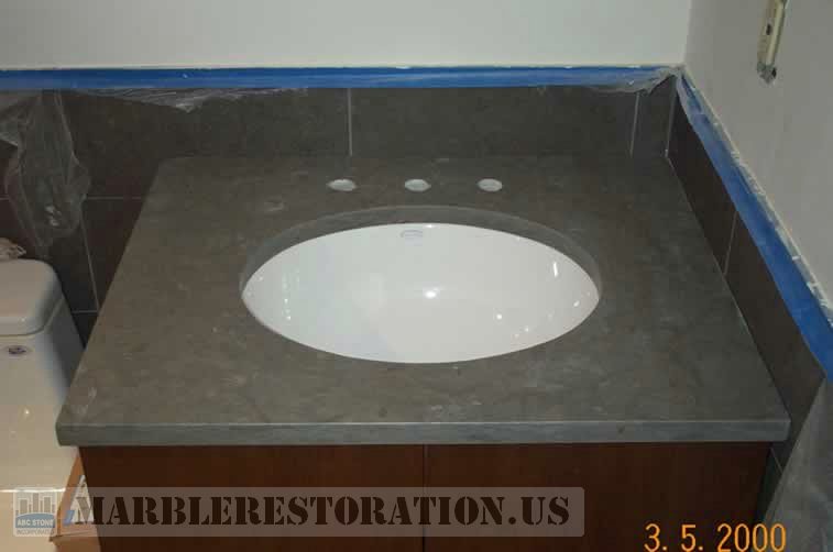 Oval Sink Installed on Limestone Vanity