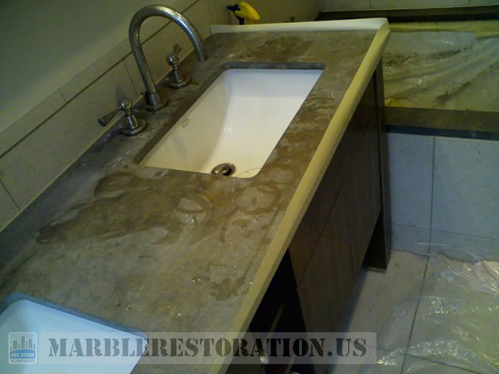 Splotchy Etches and Dull Spots on Brown Limestone Vanity