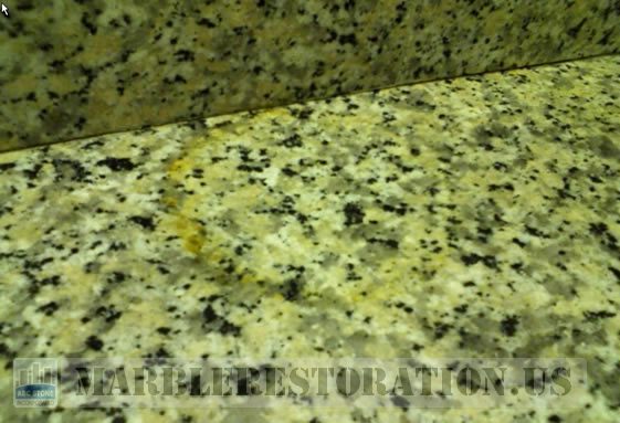 Rust Stain on Counter Top. Golden Granite