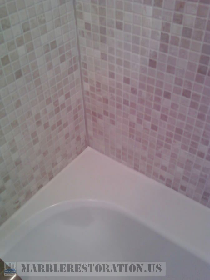 Two colors recaulking on acrylic tub and mosaic wall