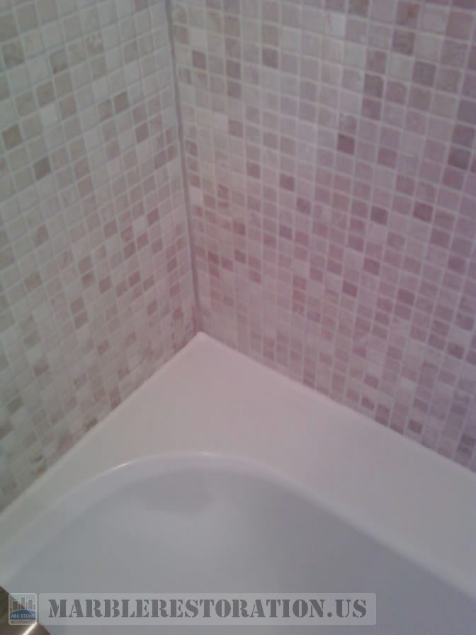 Two colors recaulking on acrylic tub and mosaic wall