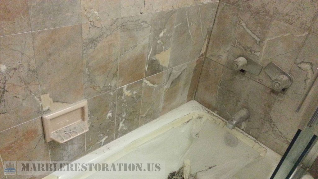 Brownish Yellow Beige Marble Walls above Tub Erosion