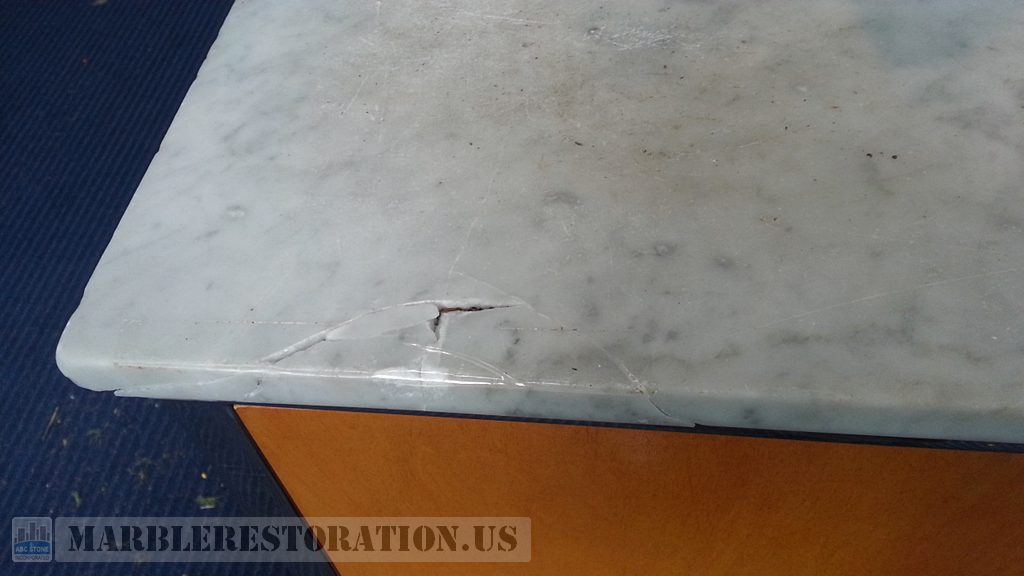Bruised Ding On Edge of Credenza Top