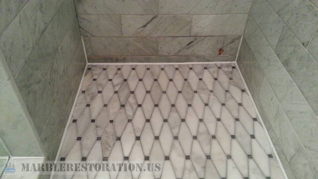 Marble Shower Floor With White Caulk Perimeter