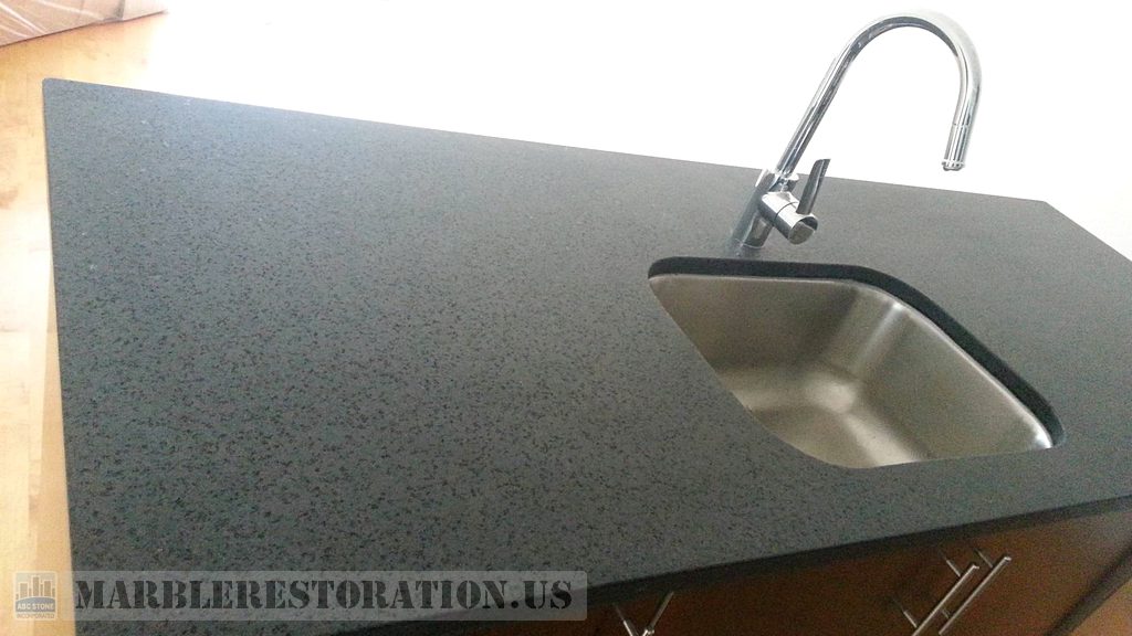 Rehoned Gray Granite Black Flakes on Kitchen Counter