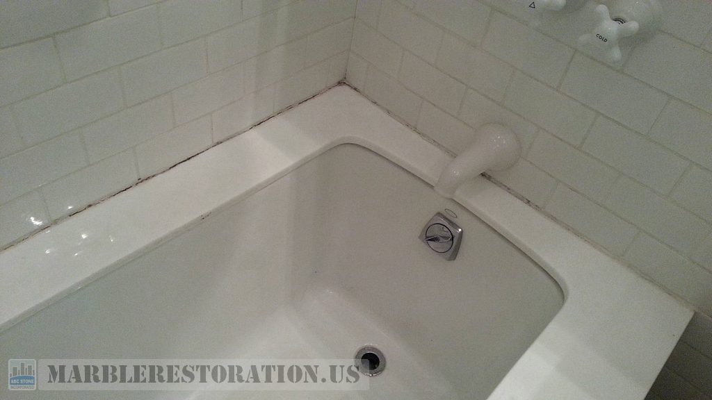 White Glass Bathtub Top Before Recaulking