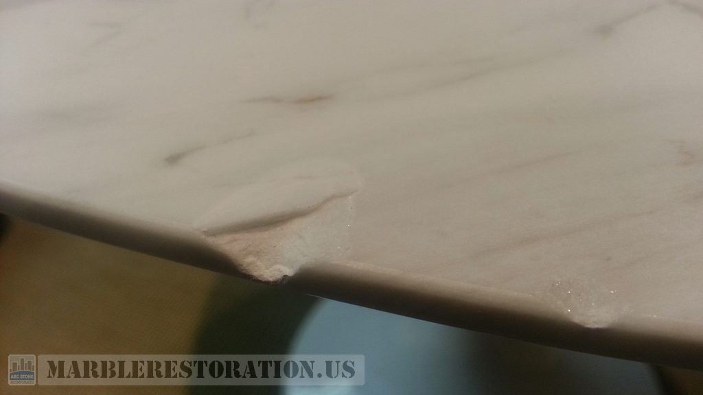 White Marble Gouge On Table Edge